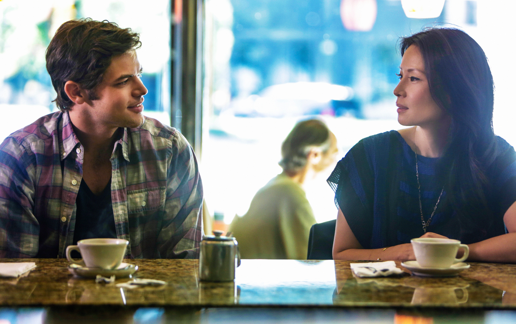 Joan meets with the son of a former patient