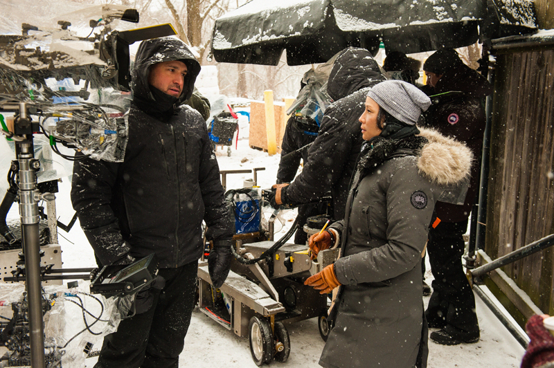 Lucy Liu discusses an exterior scene with camera and Steadicam operator, Alan Mehlbrech