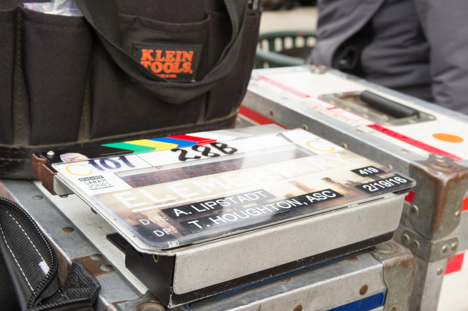 A clapboard listing the episode's director and director of photography
