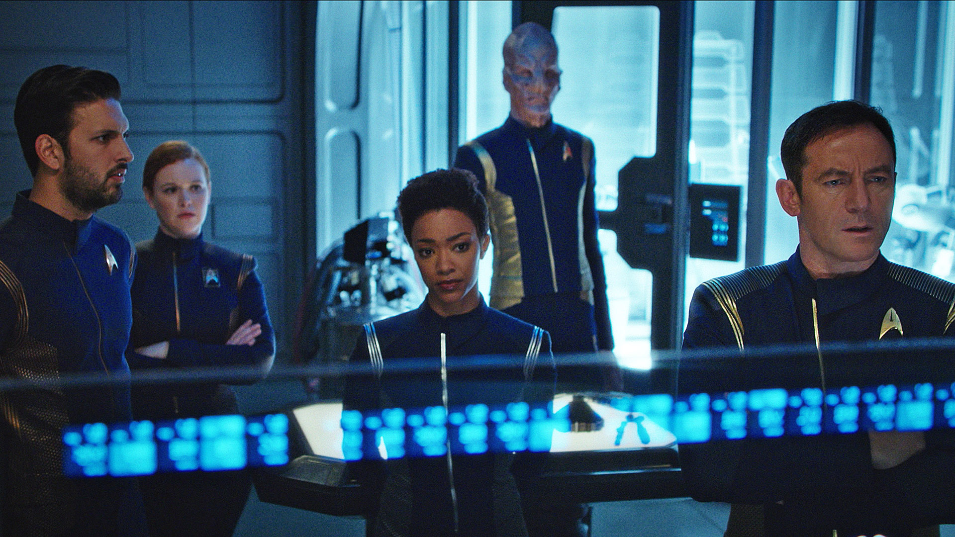 Lieutenant Ash Tyler (Shazad Latif), Cadet Sylvia Tilly (Mary Wiseman), Michael Burnham (Sonequa Martin-Green), First Officer Saru (Doug Jones), and Captain Gabriel Lorca (Jason Isaacs)