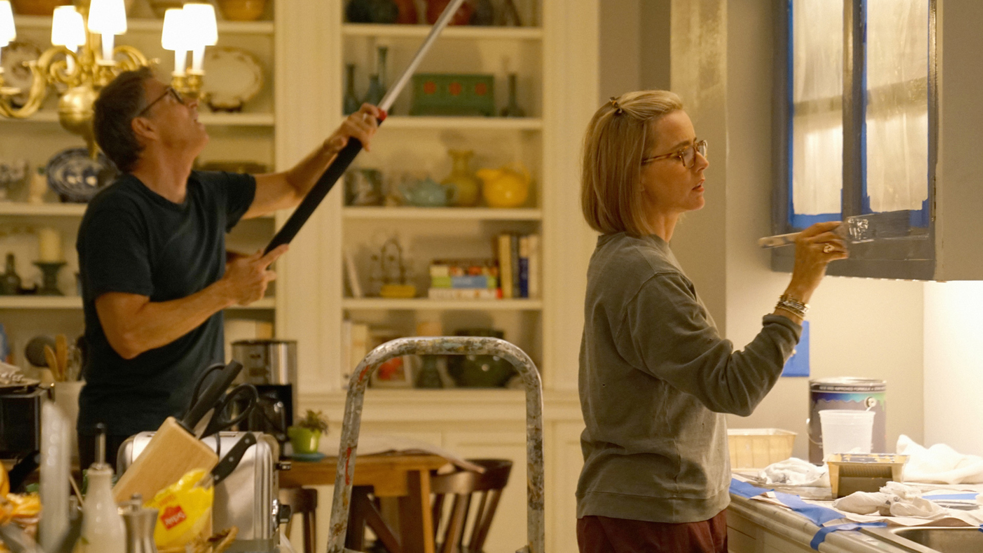 Tim Daly (Henry McCord) and Téa Leoni (Elizabeth McCord) freshen up the kitchen.