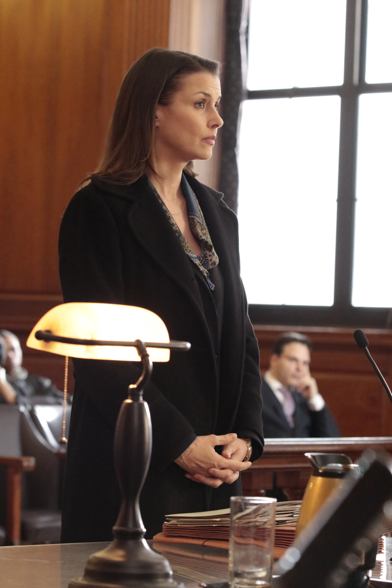 Erin Reagan stands in front of the judge.