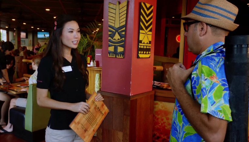Emma Wo, who plays the hostess, is a former Miss Hawaii.