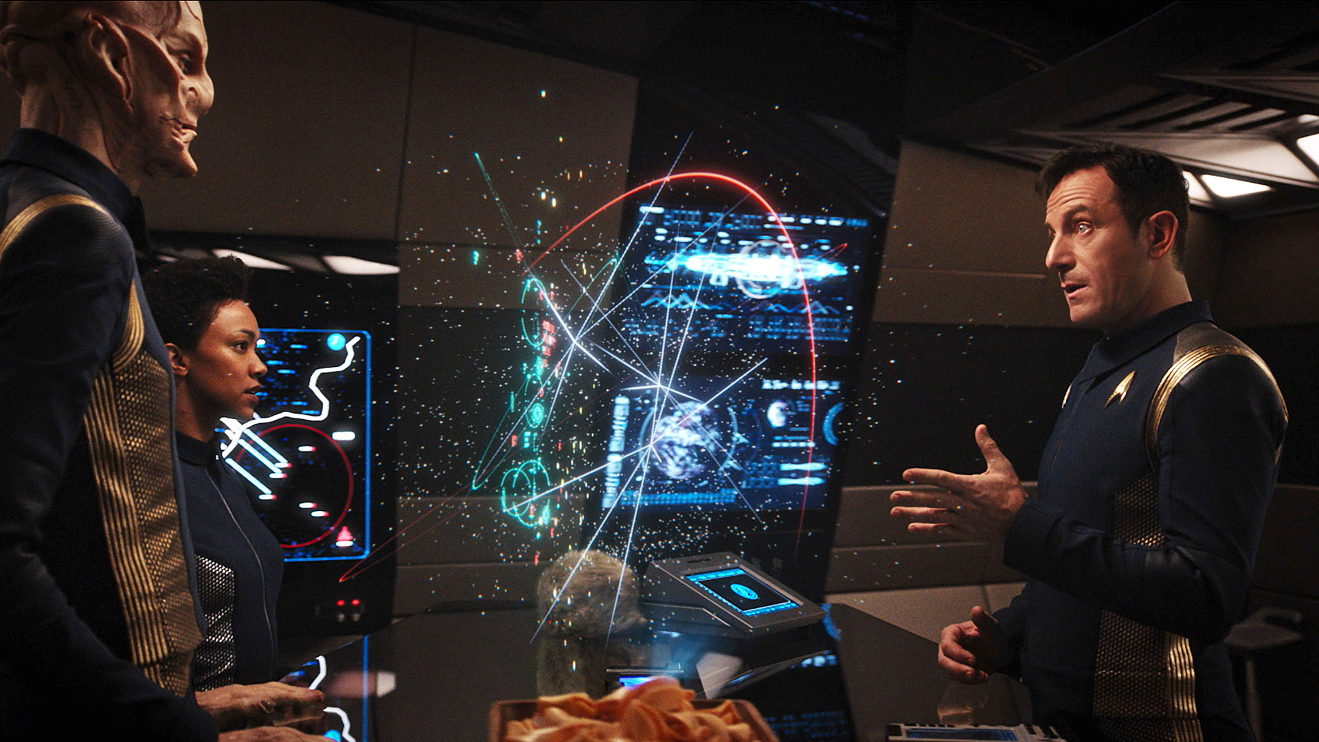 First Officer Saru (Doug Jones), Michael Burnham (Sonequa Martin-Green), and Captain Gabriel Lorca (Jason Isaacs)