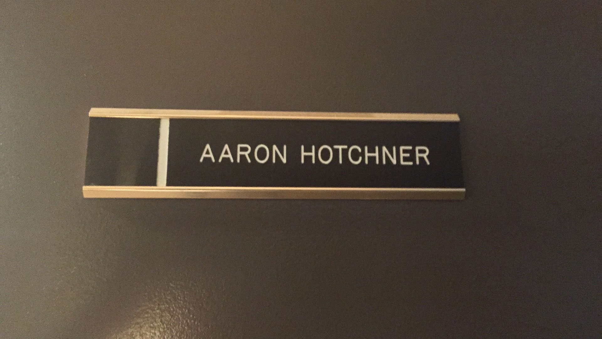 A closeup of SSA Aaron Hotchner's office door