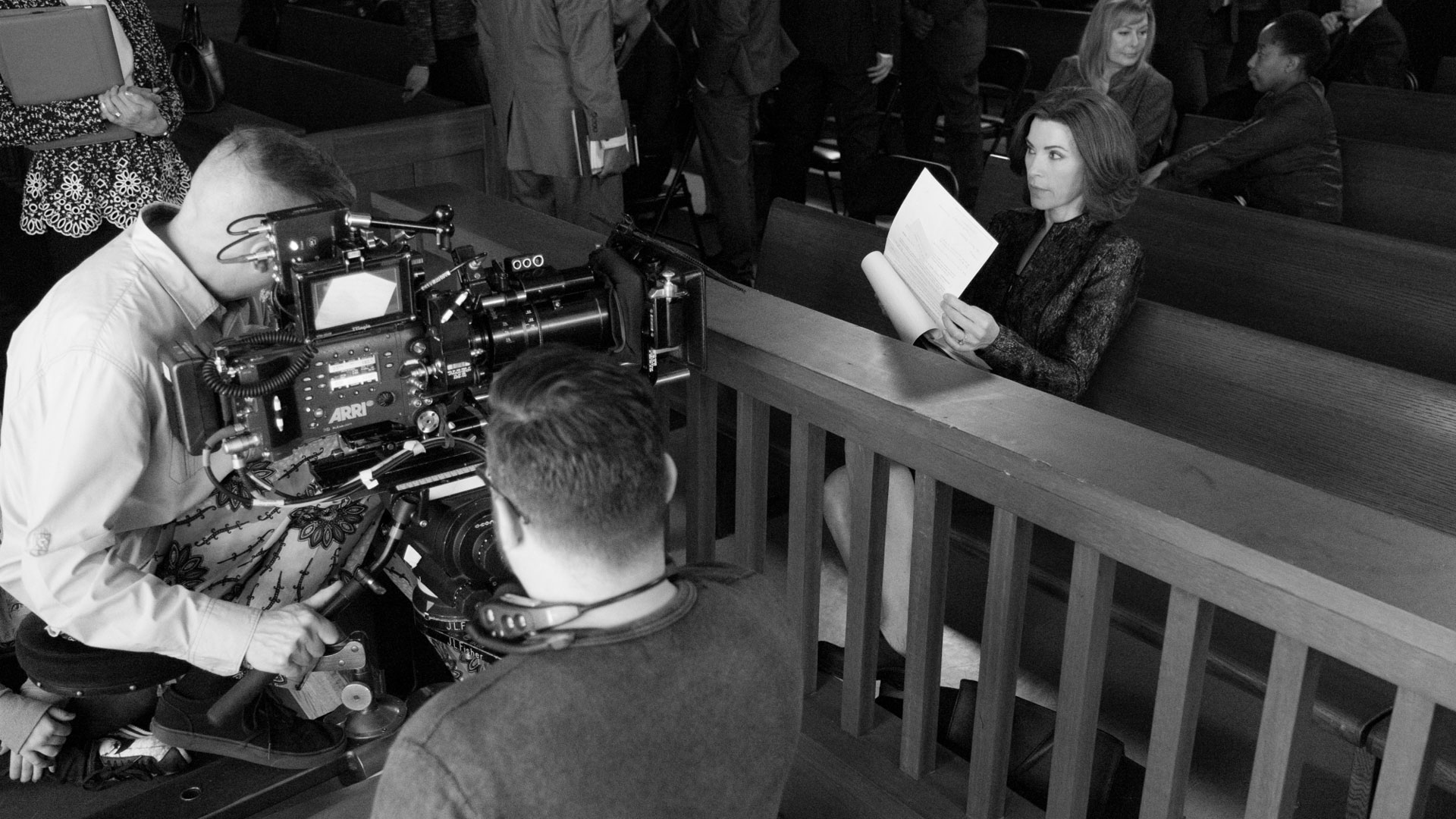 Julianna Margulies reads her script before filming starts.